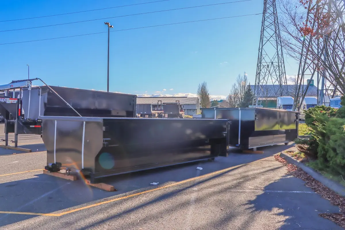 Roll-off dumpster ready for waste disposal at job site for 2 Yard Dumpster Rental in Henderson
